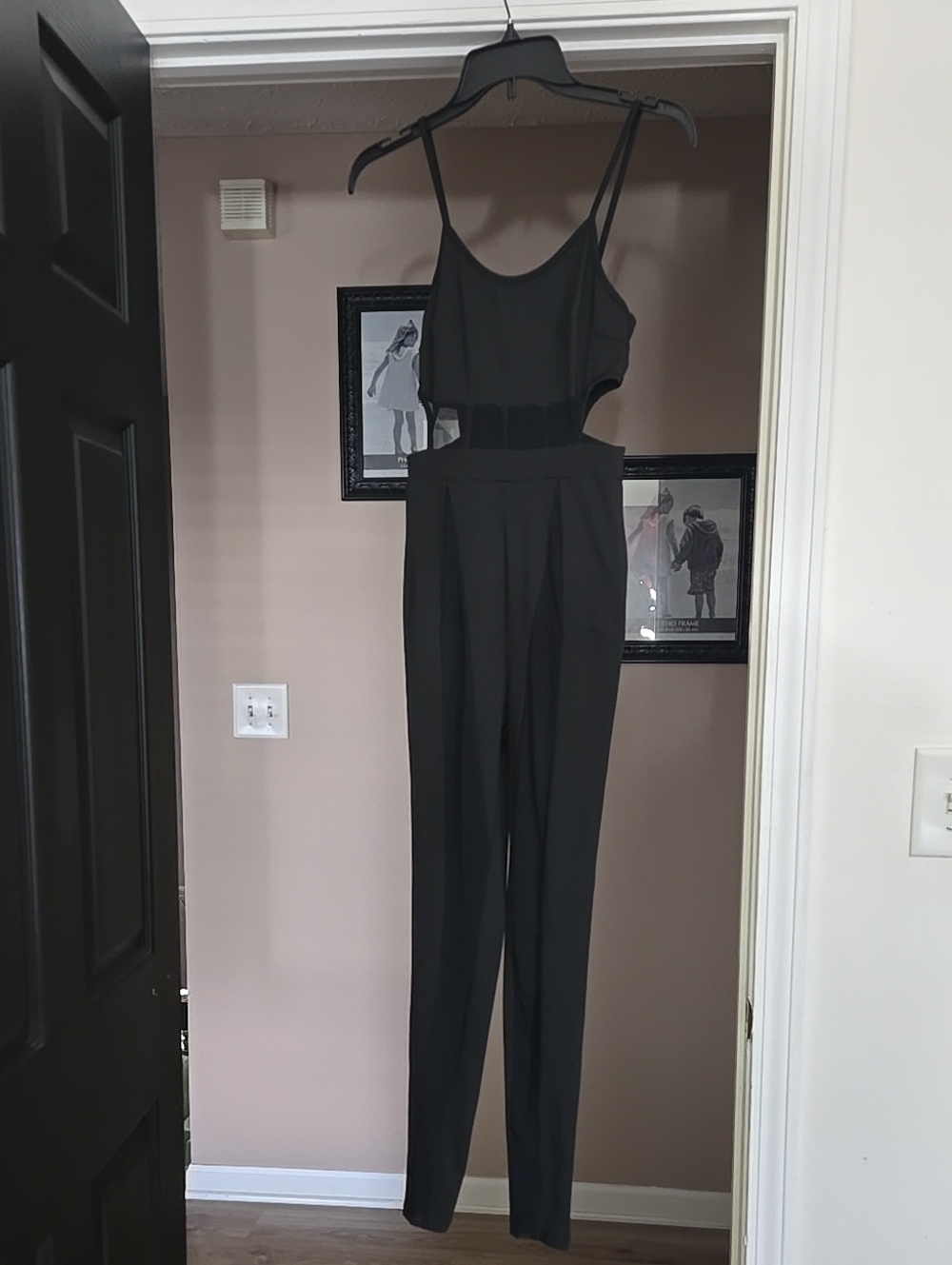 Sleeveless Black Jumpsuit with Tapered Pants, Cutout, Sheer Waist. Sheer On Legs